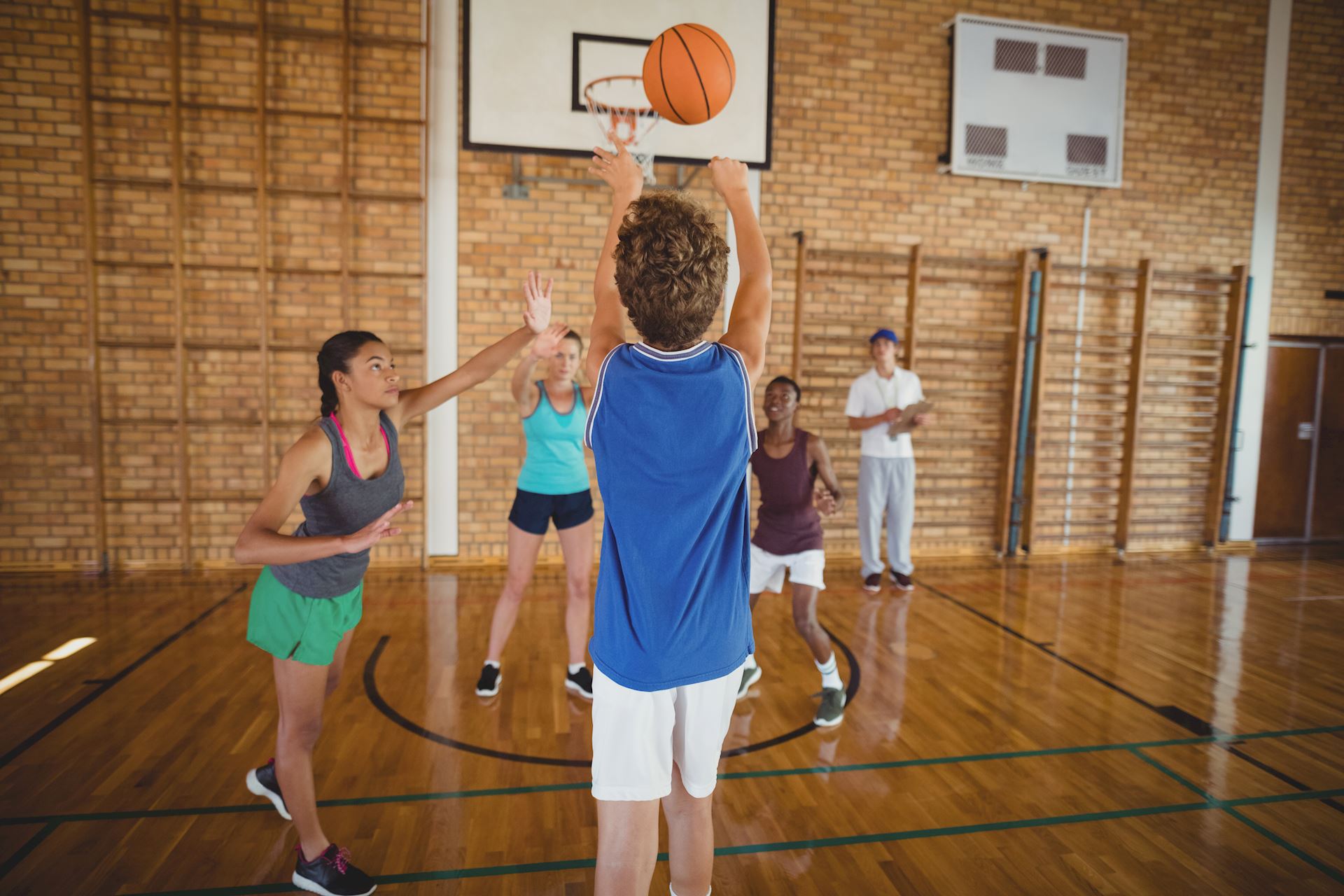 determined-high-school-kids-playing-basketball-2021-08-28-16-44-47-utc